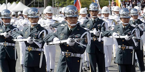 The Taiwan military honor guard performs during National Day celebrations in front of the Presidential Building in Taipei. (Photo | AP)