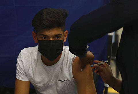 16-year-old Jayme Wiencke receives a dose of the Pfizer COVID-19 vaccine at the Vaccination Centre of Hope at the Cape Town International Convention Centre in Cape Town. (Photo | AP)