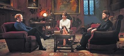 Daniel Radcliffe (Harry Potter), Emma Watson (Hermoine Granger), and Rupert Grint (Ronald Weasley) are back in a room that looks similar to Gryffindor’s common room.