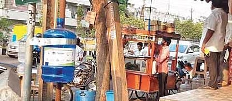 A plastic container set up in Vijayawada to collect cigarette butts | Express