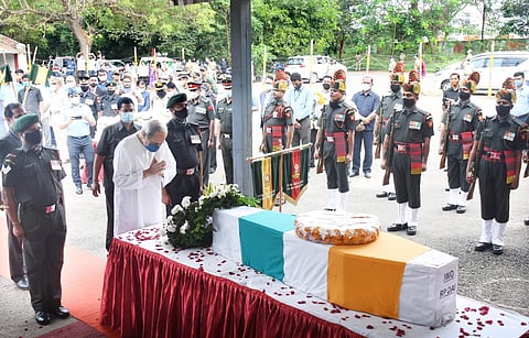 Chief Minister Naveen Patnaik paying tribute to JWO Rana Pratap Das at Bhubaneswar airport on Saturday (Photo | Express)