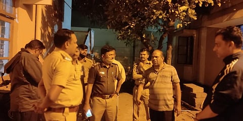 A police team meeting Father Francis DSouza on church premises after the incident on Saturday. (Photo| EPS)