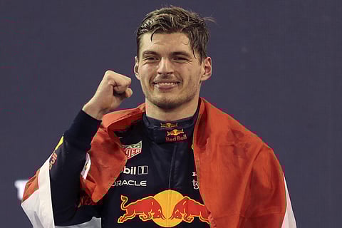 Red Bull driver Max Verstappen of the Netherlands celebrates after becoming F1 drivers world champion after winning the Formula One Abu Dhabi Grand Prix in Abu Dhabi, United Arab Emirates. (AP)