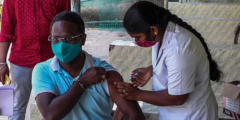 A health worker administers COVID-19 vaccine in Hyderabad. (Photo | AP)