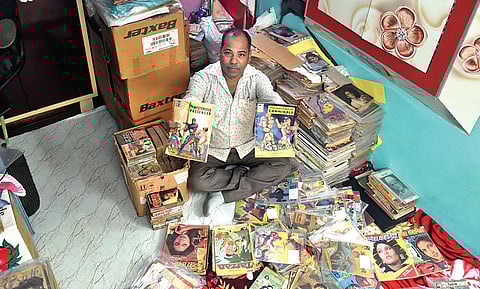 Shahid Ansari with his treasured comic book collection in his living room in Kashmere Gate. (Photo| Parveen Negi, EPS)