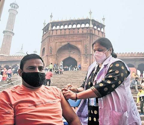 A health worker administers COVID-19 vaccine at a camp at Jama Masjid. (Photo | Parveen Negi, EPS)