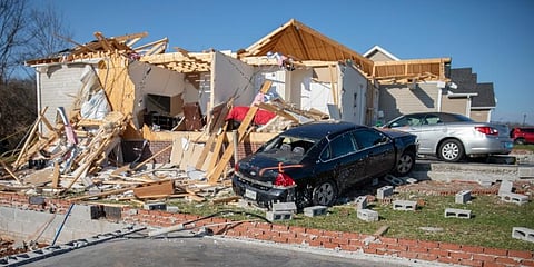 Damaged cars and homes in Bowling Green, Ky. (Photo | AP)