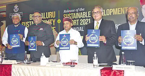 Governor Thaawarchand Gehlot (centre) releases the Sustainable Development Report, 2021, prepared by OP Jindal Global University. (Photo| Vinod Kumar T, EPS)