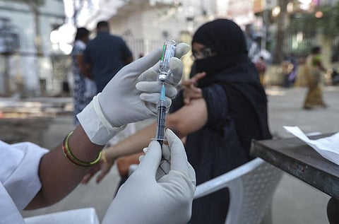 A health worker prepares to administer a dose of Covishield vaccine for COVID-19 in Hyderabad. (Photo | AP)