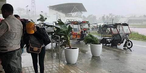 Storm evacuees take cover as strong winds blow in Dapa town, Siargao, Surigao del Norte province, southern Philippines on Thursday, Dec. 16, 2021. (Photo | AP)