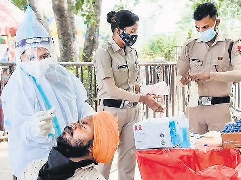 RT-PCR tests are mandatory for the passengers arriving from “at-risk” countries, and allowed to leave the airport only after the results come. (Photo | Express)