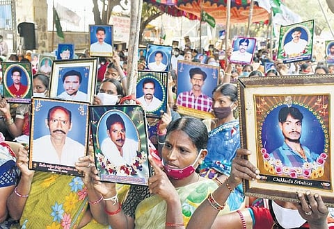 Women at the hearing hold up photos of their deceased kin (Photo | Express, S Senbagapandiyan)