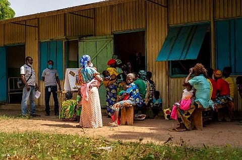 Mothers queue to have their kids examined by health workers and to receive nutrient pastes at a health center in Paoua on December 3, 2021. (Photo | AP)