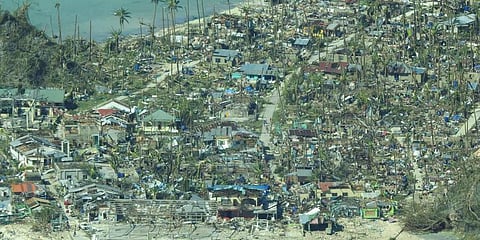 This photo provided by the Philippine Coast Guard, shows damaged houses caused by Typhoon Rai at a coastal village in Surigao del Norte province, southern Philippines on Dec. 17, 2021. (Photo | AP)