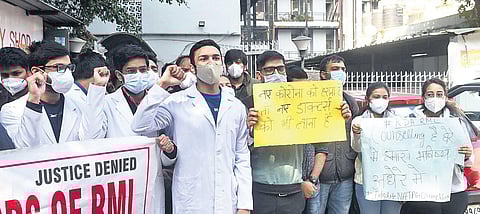Resident doctors of Ram Manohar Lohia Hospital conduct protest march inside the campus on Friday. (Photo | Parveen Negi)