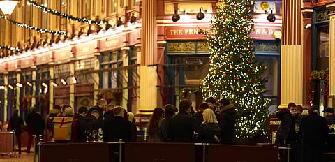 Customers drink outside a bar in London, Friday, Dec. 17, 2021. (Photo | AP)