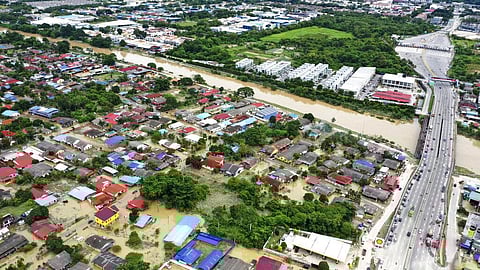 This aerial view shows a flooded village in Puchong, outside Kuala Lumpur, Malaysia, Sunday, Dec. 19, 2021. (Photo | AP)
