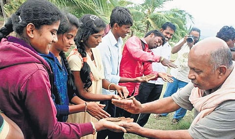 SOIL founder secretary P Srinivas Vasu explains about the features of soil to some participants at a workshop