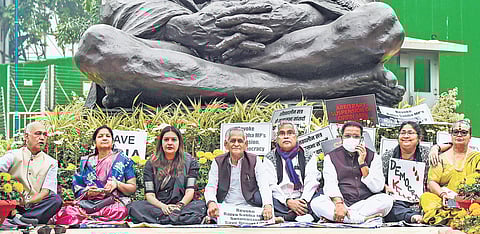 Suspended Rajya Sabha MPs stage dharna demanding revocation of their suspension in Parliament. (Photo | PTI)
