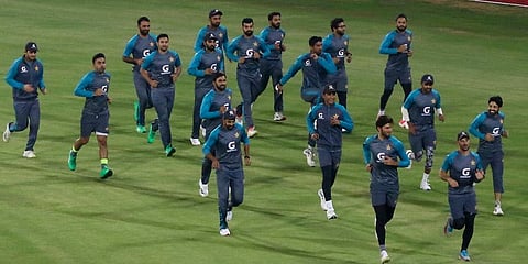 Players of Pakistan Cricket team warm up ahead of practice session at the National Stadium, in Karachi, Pakistan, Saturday, Dec. 11, 2021. (Photo | AP)
