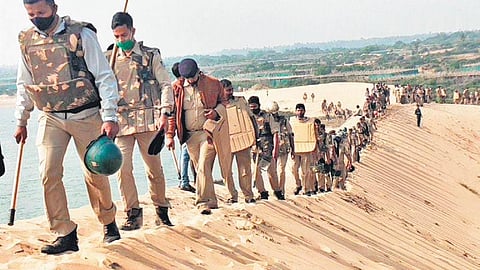 Police personnel deployed for the demarcation exercise and villagers pelting stones at the forces | Express