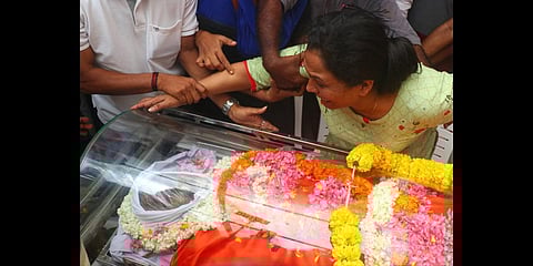 Lisha, wife of Renjith, is inconsolable when his body is brought to his house at Vellakinar in Alappuzha on Monday | Express