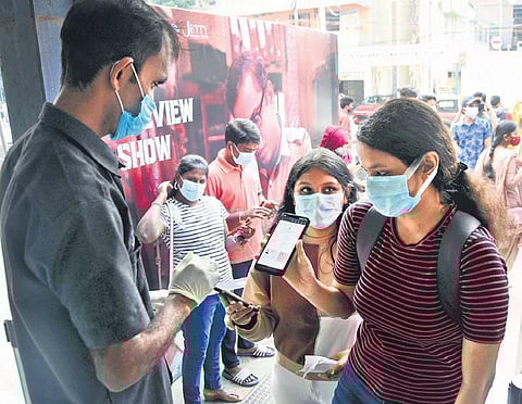 Vaccine certificates of moviegoers being checked at the entrance of the cinema complex at Sathyam theatre in Chennai on Tuesday | Ashwin prasath