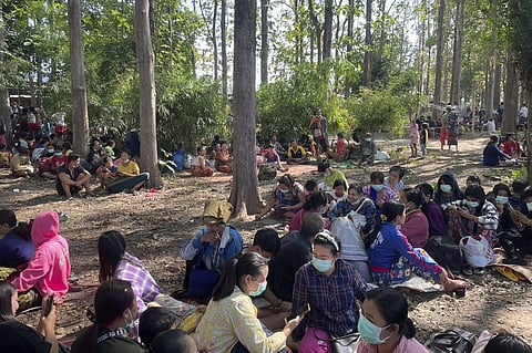 Myanmar villagers rest in an evacuation area after fleeing to Thailand following clashes between Myanmar troops and an ethnic Karen rebel group Friday, Dec. 17, 2021, in Mae Tao, Myanmar. (AP)