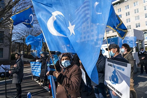 Members of the East Turkistan National Awakening Movement protest China's treatment of Uyghurs, during a protest near the State Department,in Washington. (Photo | AP)