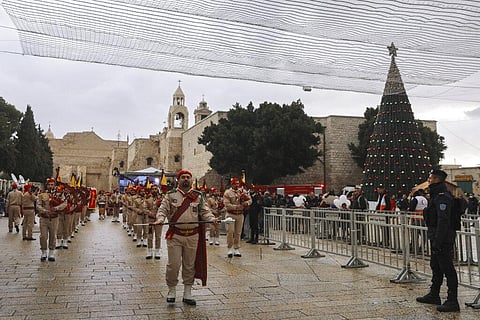 Palestinian scout band members parade through Manger Square at the Church of the Nativity, traditionally believed to be the birthplace of Jesus Christ. (Photo | AP)