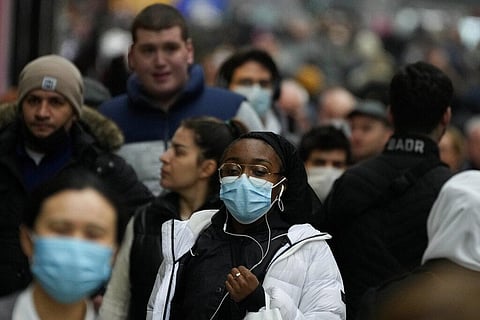 Shoppers walk down Oxford Street, Europe's busiest shopping street, in London, Thursday, Dec. 23, 2021. (Photo | AP)