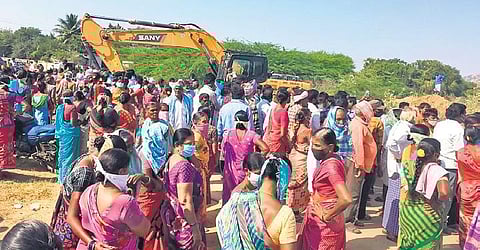Residents of Gudatipally village in Akkannapet mandal obstruct the construction of a road that leads to Husnabad, on Thursday.