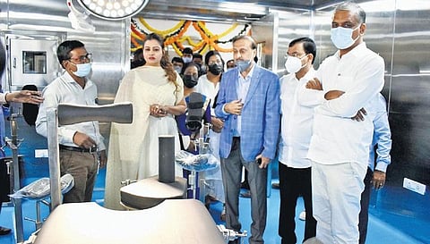 Health Minister T Harish Rao inspects the ICU ward after inaugurating it at the Durgabai Deshmukh Hospital. Also seen is MEIL director P Sudha Reddy