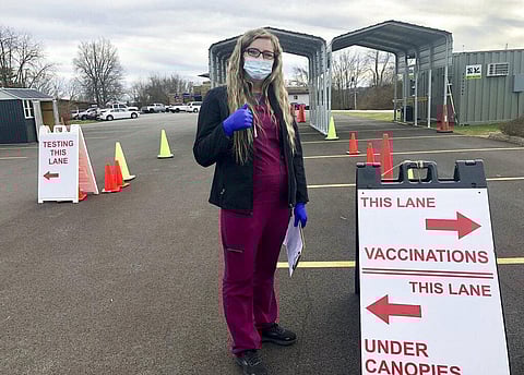 Roane General Hospital nurse Chania Batten is shown at a drive-thru COVID-19 vaccination clinic Tuesday, Dec. 21, 2021, in Spencer, W.Va. (Photo | AP)