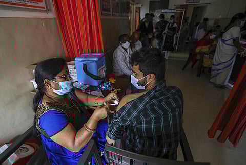 A health worker administers Covaxin COVID-19 vaccine to a man in Hyderabad, India, Monday, Dec. 27, 2021. (Photo | AP)