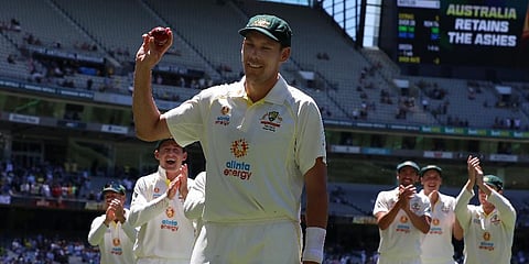 Australia's Scott Boland, center, holds up the ball after taking 6 wickets against England in their win on the third day of their cricket test match in Melbourne, Australia, Dec. 28, 2021 (Photo | AP)
