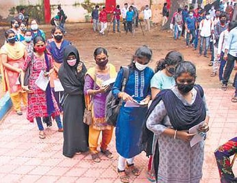 File photo of candidates queueing up in front of an examination hall
