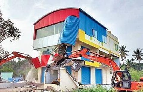 File picture of an illigal structure being razed at Sonashettyhalli in Oct