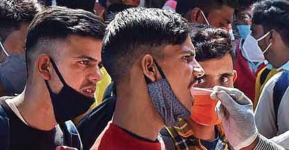 A man gives his sample at KSR Railway Station in Bengaluru. (Photo | Vinod Kumar T/EPS)