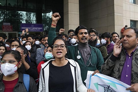 Junior doctors of a government medical college hospital who are on their second week of strike, shout anti-government slogans as they march in New Delhi, India, Tuesday, Dec. 28, 2021. (Photo | AP)