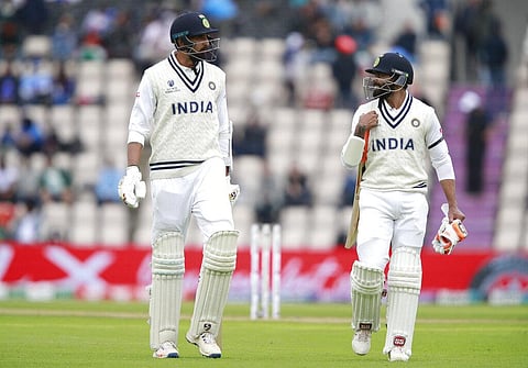 India's Ravindra Jadeja, right, and Ishant Sharma walk off the field for lunch during the third day of the World Test Championship final cricket match against New Zealand (Photo | AP)