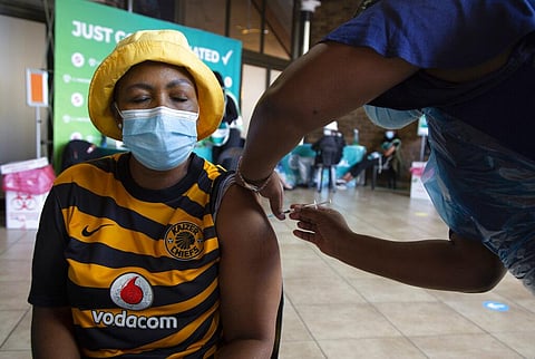 A woman receives a COVID-19 vaccine at a facility in Soweto, South Africa, Wednesday Dec. 2, 2021. (Photo | AP)