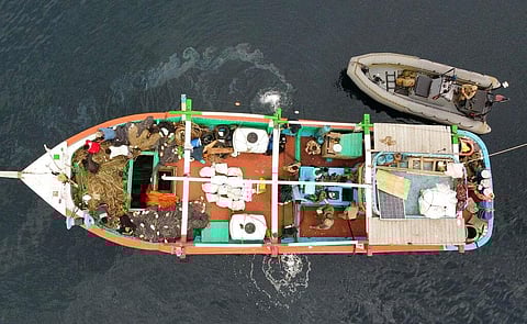 U.S. service members inventory an illicit shipment of drugs while aboard a stateless dhow vessel transiting international waters in the Arabian Sea.(Photo | AP)