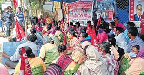 Workers on the 29th day of their protest outside the ITI premises