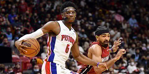 Detroit Pistons guard Hamidou Diallo grabs a loose rebound as Miami Heat guard Gabe Vincent (R) defends during an NBA match in Miami. (Photo| AP)