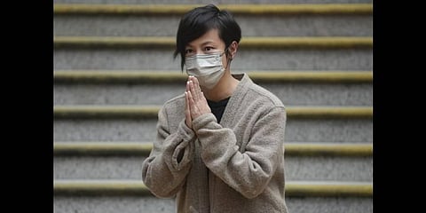 Hong Kong activist and music star Denise Ho bows as she is released from custody, she was arrested in relation to colonial-era charges of sedition, because she was connected to Stand News (Photo | AP)