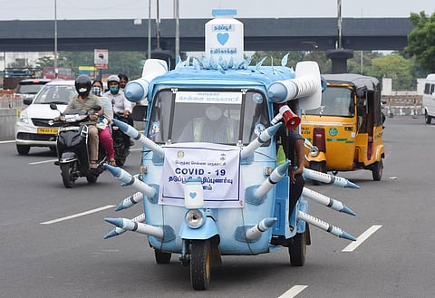 A Greater Chennai Corporation worker drives an auto-rickshaw decorated with mock syringes to boost awareness on the importance of Covid-19 vaccination. (Photo | Ashwin Prasath, EPS)