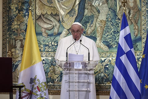Pope Francis delivers his speech during a meeting with authorities, at the Presidential Palace, in Athens, Saturday, Dec. 4, 2021.
