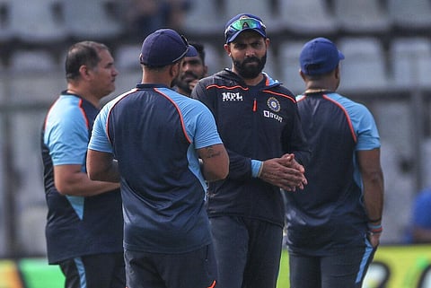 India's Ravindra Jadeja speak with team members before the start of the day one of second test cricket match against New Zealand in Mumbai. (Photo | AP)