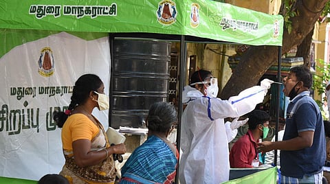 Health workers taking swab sample of a person at a kiosk in Madurai. (File Photo | KK Sundar)